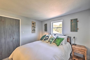 Cozy queen bedroom, your summer sanctuary for sweet dreams and relaxation.