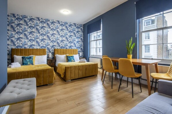Room 1 has 2 queen-size bed and a sofa bed, it can fit up to 6 people.