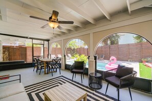 Escape to our cozy screened-in backyard area!