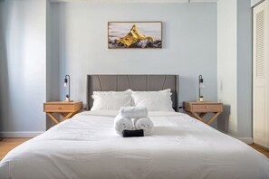 Beautiful cozy bedroom with quality mattress, duvet and complete towel sets.