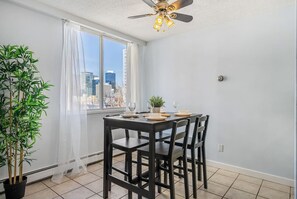 Dining table with 4 seats, comes with all dinner ware. (Kids incl)