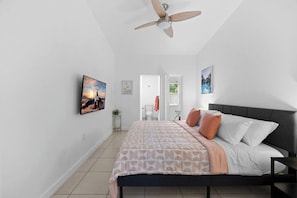 We also provide a room featuring a king-sized bed, a smart TV, a full-length mirror, an en-suite bathroom, and a walk-in closet.