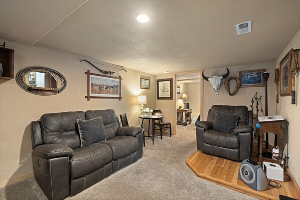 Old west den couches, chairs, with rustic relish antiques and furnishings.