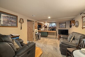 Old west den couches, chairs, with rustic relish antiques and furnishings.