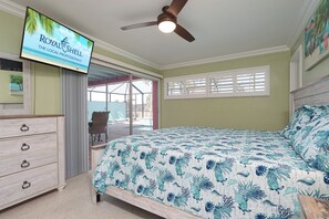 Primary Bedroom with king bed & wall-mounted SmartTV