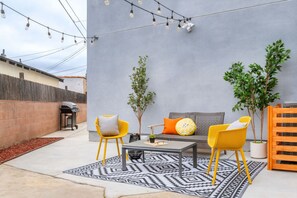 Embark on an outdoor journey in our backyard sanctuary, where the BBQ sizzles with flavor and the corn hole board promises endless entertainment. Your perfect paradise day awaits.