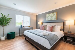 Experience true comfort in our king bed oasis, complete with a walk-in closet stocked with plush slippers. Your perfect getaway starts here, with relaxation at its finest.