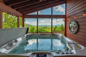 Luxurious hot tub with mountain views and seating for 6.