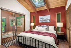 Indulge in luxury in the primary suite with direct access to a private hot tub, perfect for unwinding under the stars.