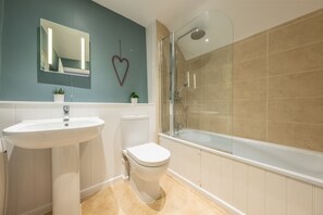 Carpenters Cottage, Wighton: Bathroom with a bath with shower over