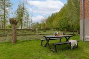 Enjoy a lovely meal in the sunny garden overlooking the green fields