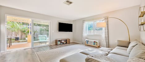Living Room w/ sectional, large flat screen TV