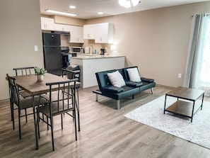 Living room, kitchen, and dining room