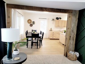 Open concept from living room into kitchen area. Great lighting with plenty of room for dinner and relaxing. 