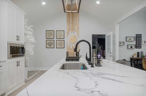 "Our kitchen features stainless steel appliances and granite countertops."


