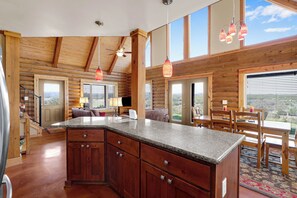 Large windows flood the space with natural lighting and endless views