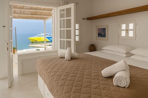 Bedroom 1 – cozy and well-lit with sea-facing window

