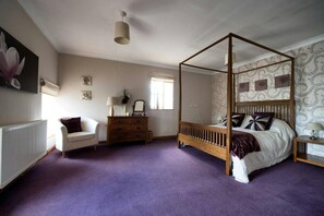 Four poster double bed, chair and chest of drawers