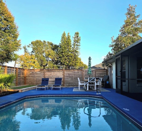 Lovely private pool area with loungers, dining table with seating for 6
