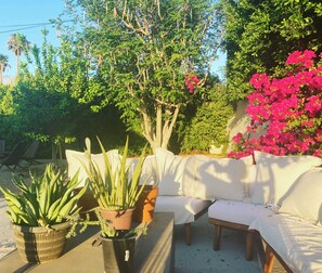 From our big couch outside you can see the mountains and have a fire at night