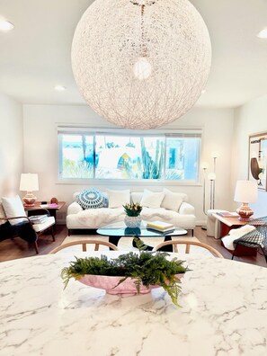 A view from the dining area, to the first living room and our HUGE cactus! 