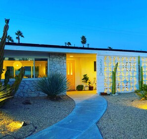 The house at night is magical - the breeze block wall really lights up like lace