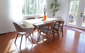 Walnut table and comfortable chairs seat up to 6.