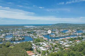 Aerial past Noosa Waters, Noosa River to River mouth and ocean