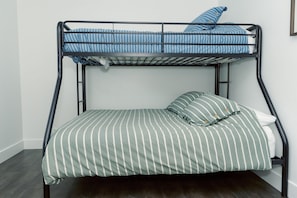 Bunk beds in third bed, full size bottom with a twin on top.