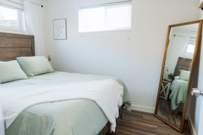 Queen size bed in bedroom 1