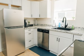 Coffee station, fridge, and dishwasher