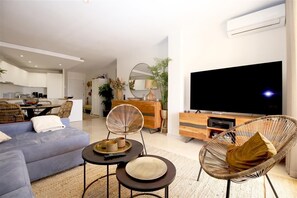 Stylish and bright lounge area with comfortable seating and air conditioning