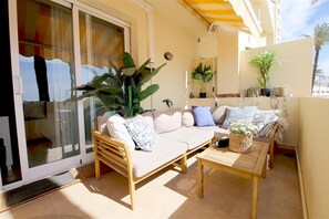 Relaxing seating on the balcony with space for four guests