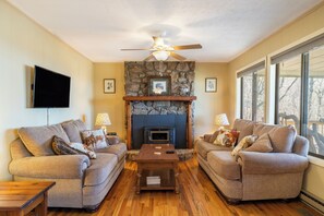Cozy living room vibes with a crackling fireplace.