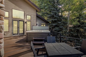 Deck Area Featuring a Private Hot Tub and Outdoor Dining.