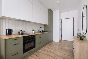 The fully equipped kitchenette includes everything you need for a home-cooked meal.