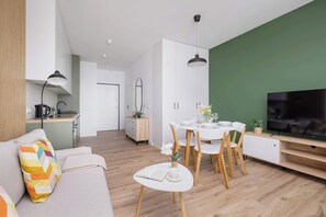 Relax in the stylish living area with a comfortable sofa and modern decor.