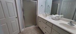 Master bathroom with a walk in shower.