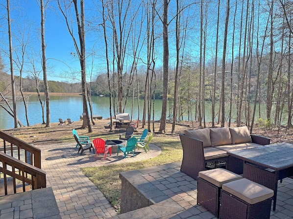 Welcome to Serenity Cove - A peaceful mountain lakefront home in Rumbling Bald. Wonderful outdoor spaces include private dock and watercraft, fire pit area, outdoor seating...