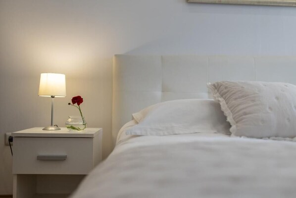 Bathroom 1. with king bed, shower, makeup table and exit to balcony.