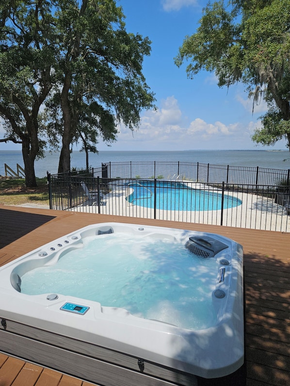View from swing over hot tub and pool