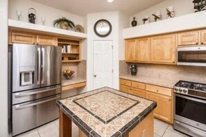 Fully stocked kitchen  with center island