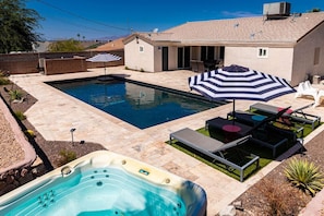 Enjoy the sparkling pool, unwind in the soothing hot tub, and soak up the sun on the spacious patio.