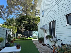 Courtyard leading to pool which is heated in colder months.