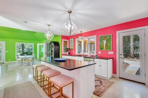 Open kitchen with seating for four at the island