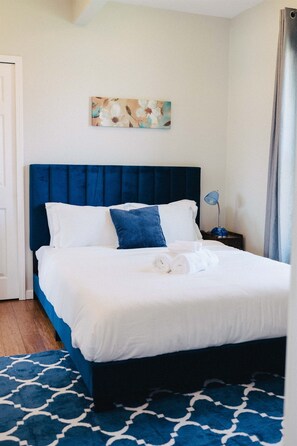 A serene escape with a cozy queen bed, perfect for a restful night's sleep.
