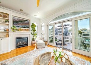 Main living room out to back deck overlooking water