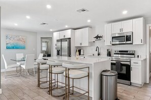 Look forward to a fully equipped and gleaming kitchen.