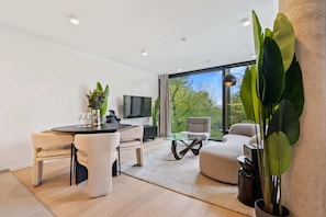 Relax in our cozy living space, offering serene views and chic comfort.