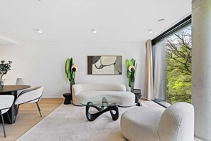 Experience seamless living with our combined dining and relaxation area.